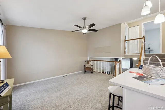 a kitchen that has a table and chairs in it