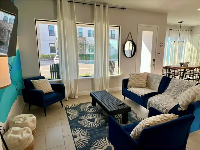 a living room with furniture and a window