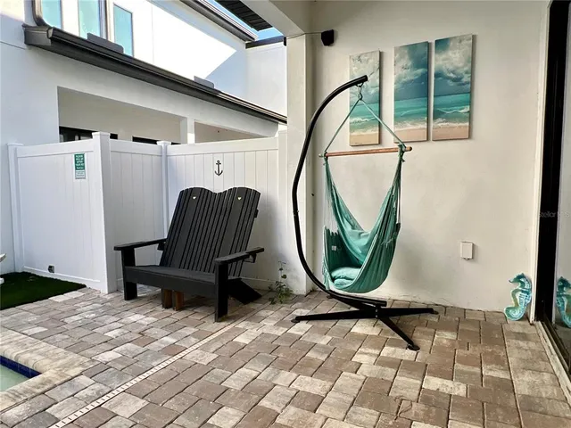 a view of a entryway with wooden floor and windows