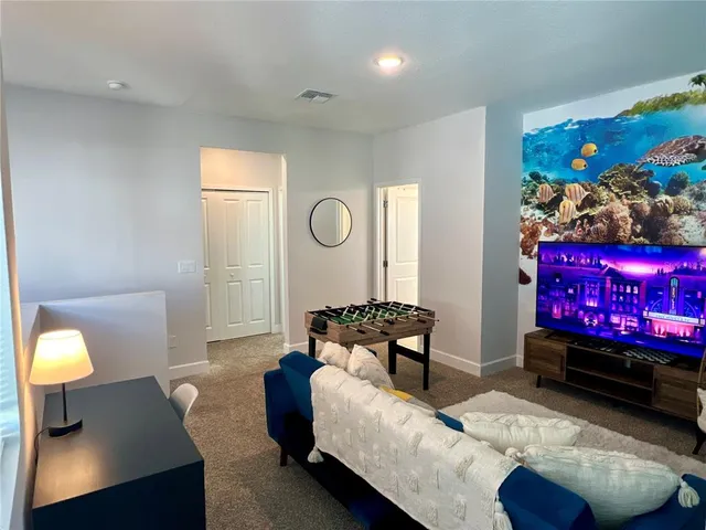 a living room with furniture and a couch