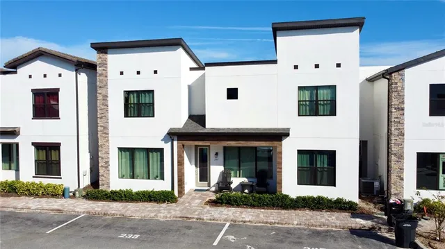 a front view of a house with yard
