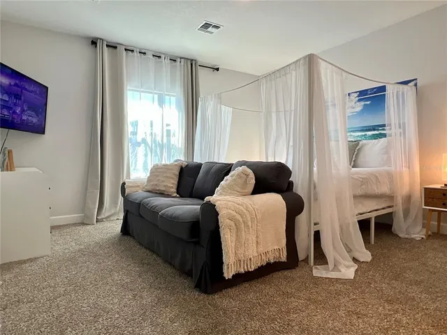 a living room with furniture and a window
