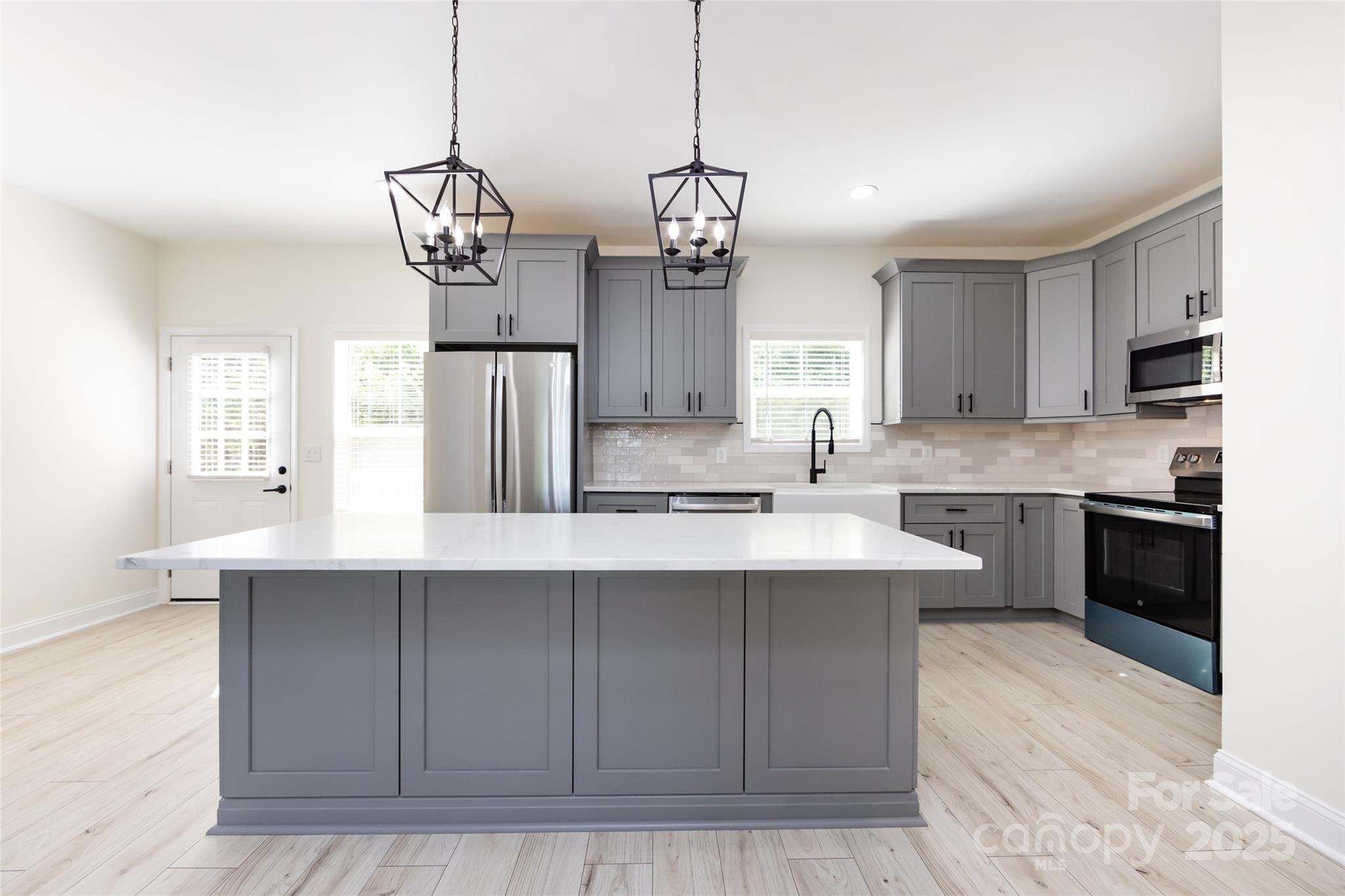 240 Doster Road Lancaster, SC 29720 - Photo 1 of 31 a kitchen with cabinets a sink and stainless steel appliances