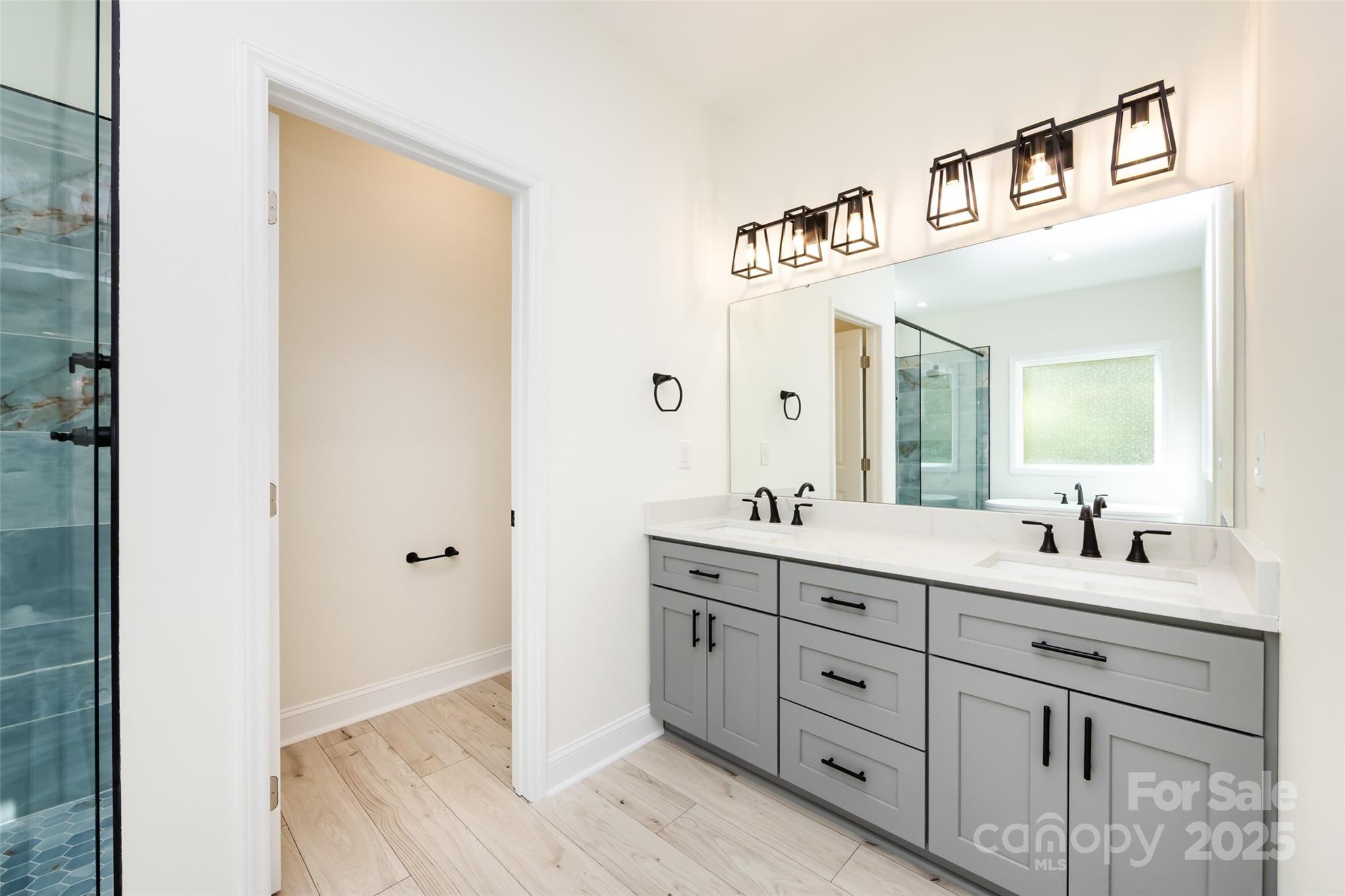 240 Doster Road Lancaster, SC 29720 - Photo 15 of 31 a bathroom with a double vanity sink and mirror