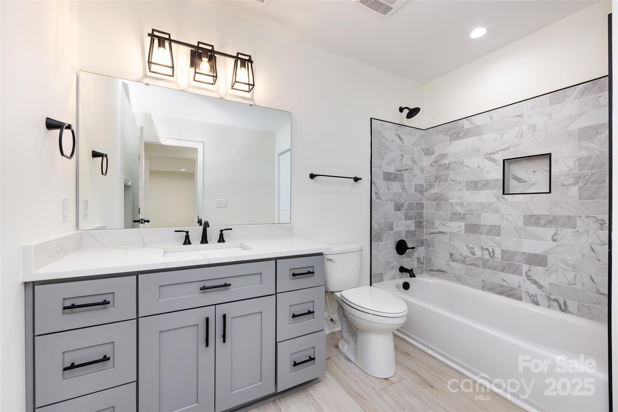 240 Doster Road Lancaster, SC 29720 - Photo 21 of 31 a bathroom with a toilet a sink a mirror a bathtub and vanity