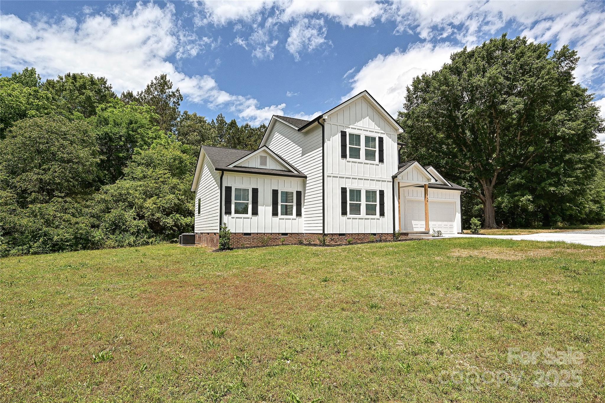 240 Doster Road Lancaster, SC 29720 - Photo 27 of 31 a front view of a house with a garden