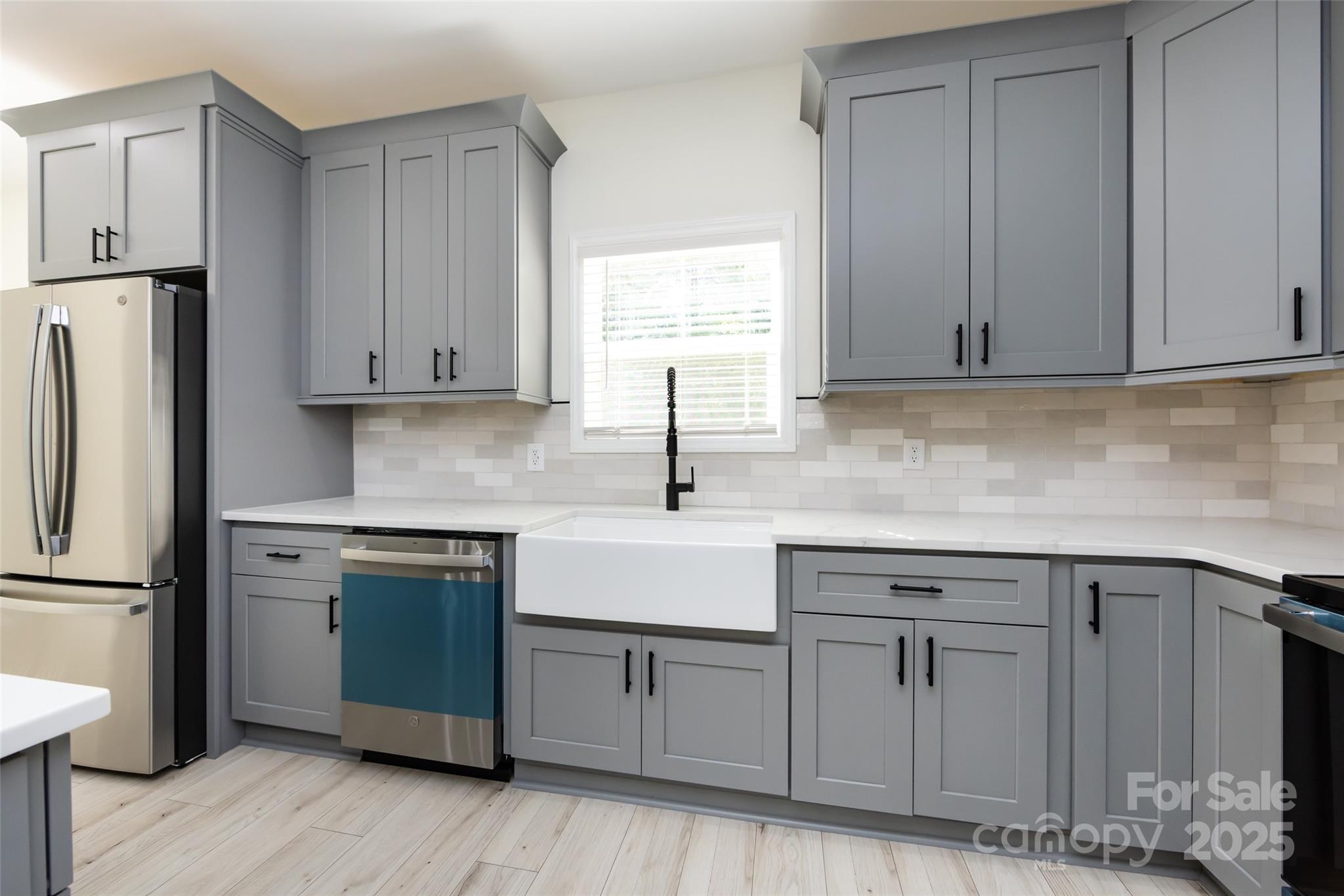 240 Doster Road Lancaster, SC 29720 - Photo 4 of 31 a kitchen with white cabinets and sink