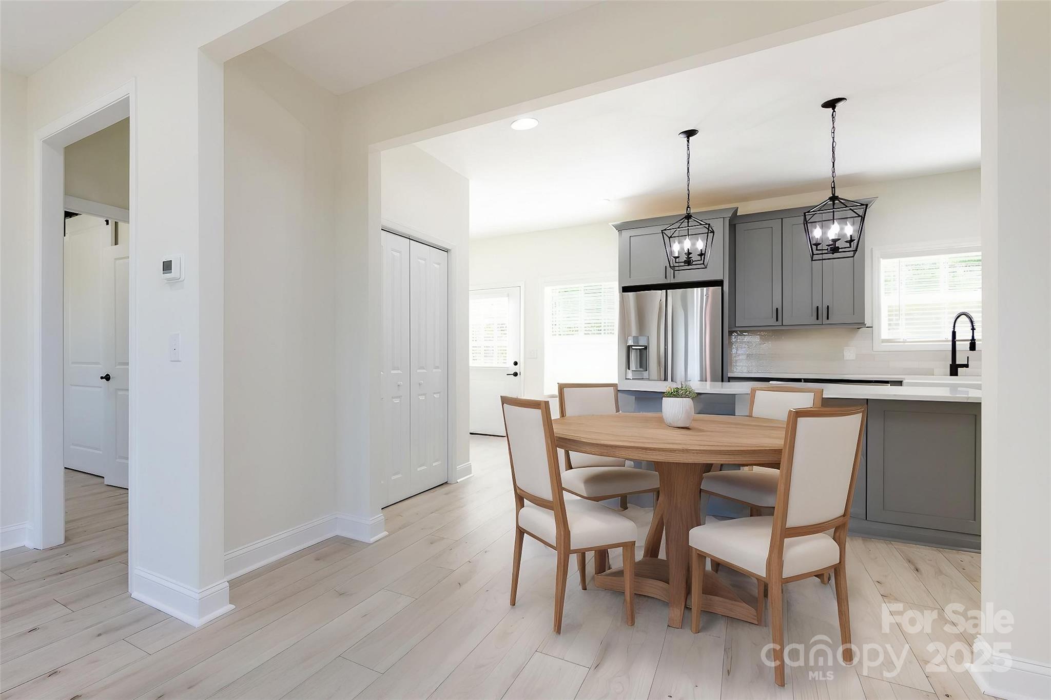 240 Doster Road Lancaster, SC 29720 - Photo 6 of 31 a kitchen with kitchen island a dining table chairs sink and cabinets
