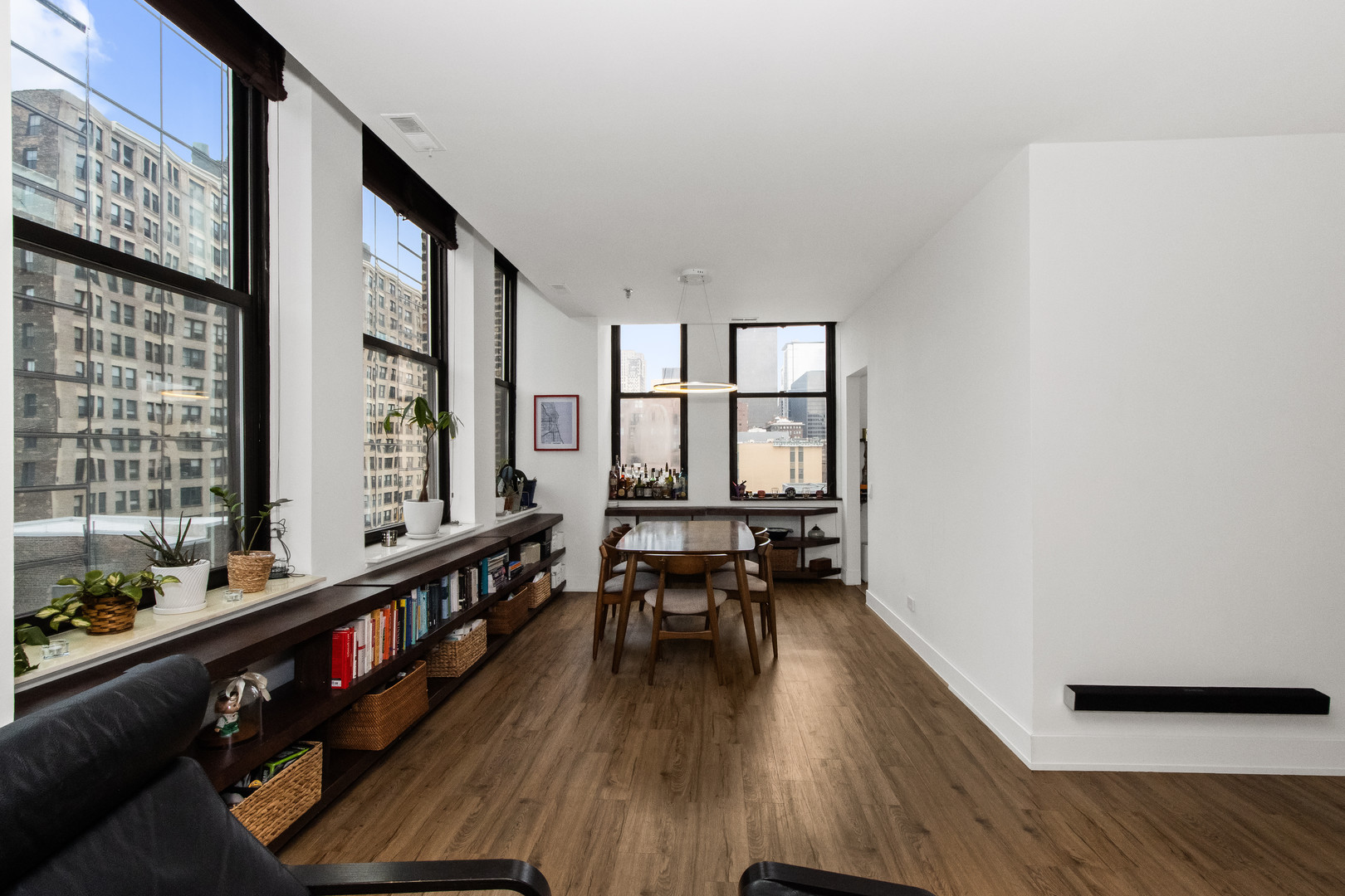 740 South Federal Street, Unit 1204 Chicago, IL 60605 - Photo 4 of 14 a very nice looking room with wooden floor and furniture