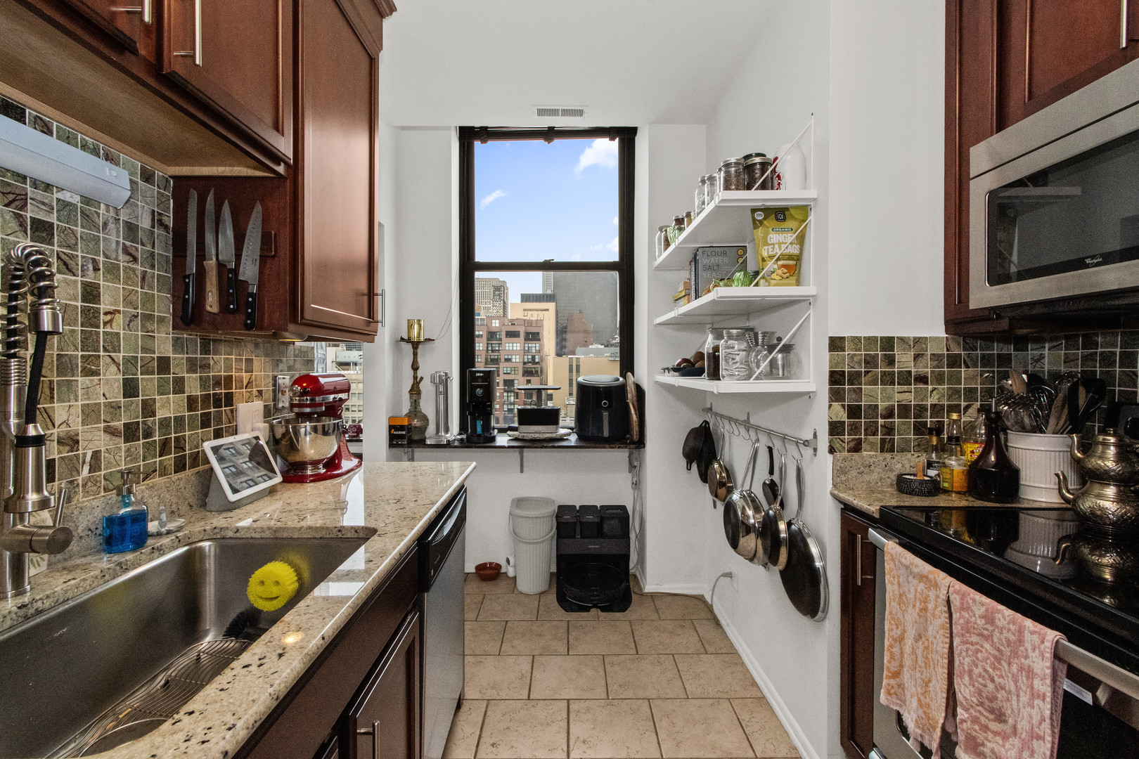 740 South Federal Street, Unit 1204 Chicago, IL 60605 - Photo 8 of 14 a kitchen with a sink appliances and cabinets