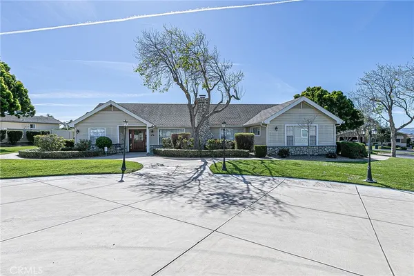 a house with a yard and large trees
