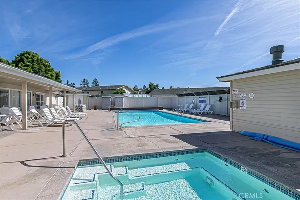 a view of a patio with a table and chairs