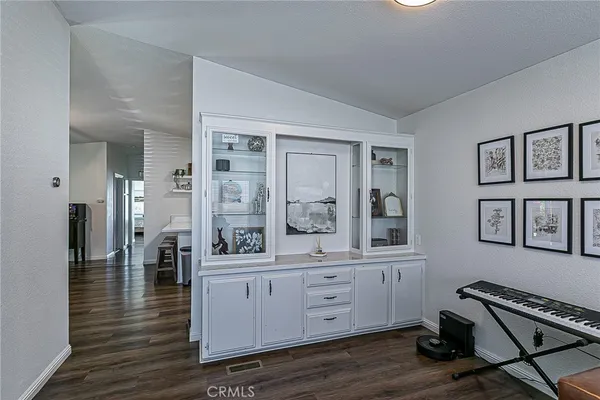 a view of room with furniture and wooden floor