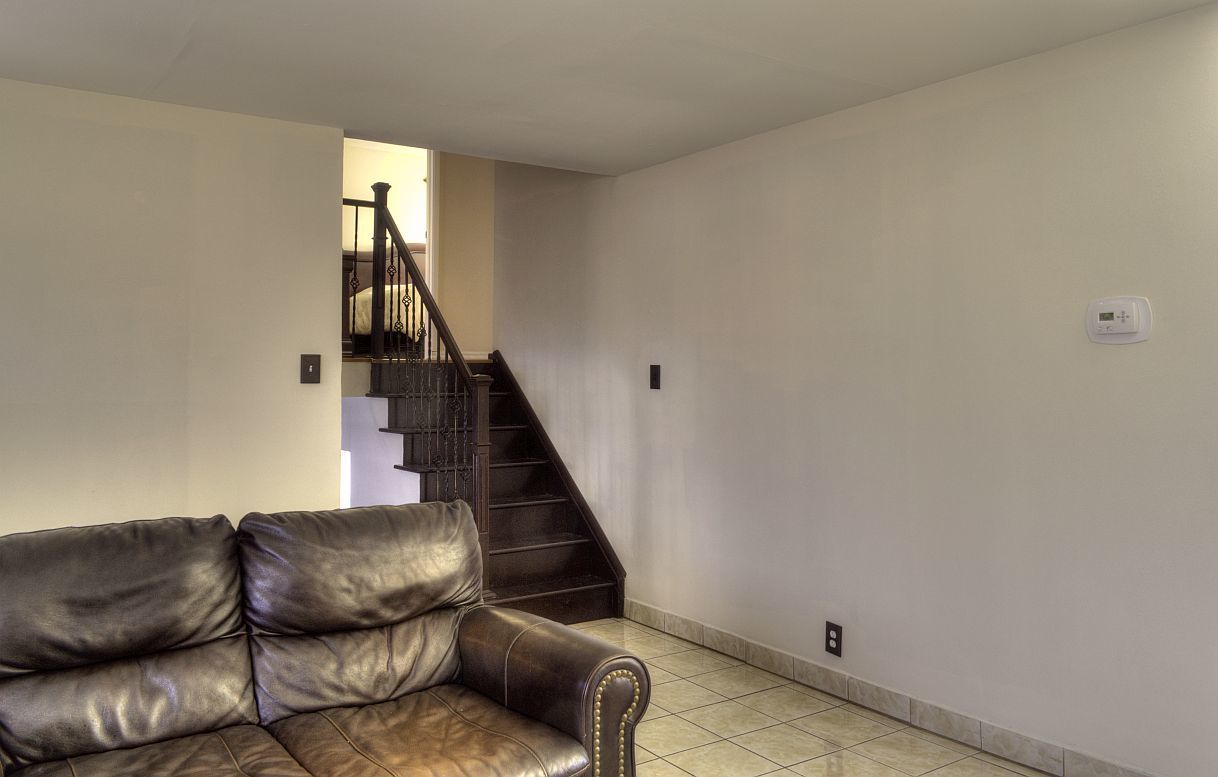 529 Spruce Road Bolingbrook, IL 60440 - Photo 8 of 34 a living room with furniture and a staircase