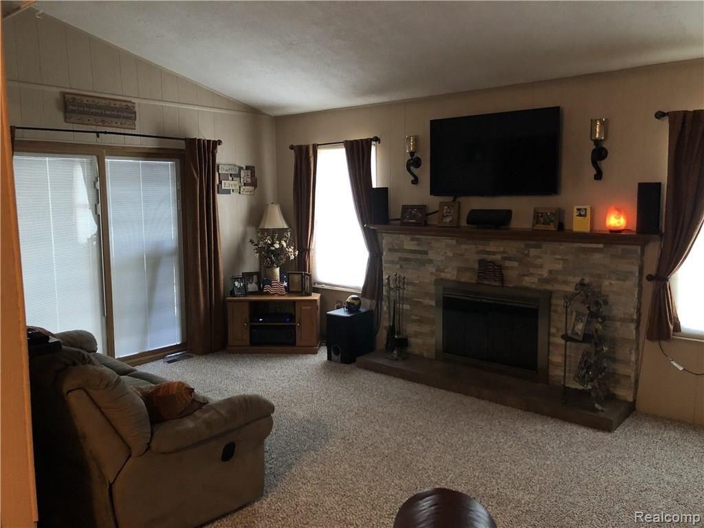 22296 Derby Road Trenton, MI 48183 - Photo 6 of 21 Family room with natural fireplace