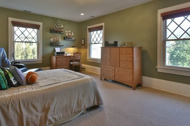 a bedroom with a bed and dresser