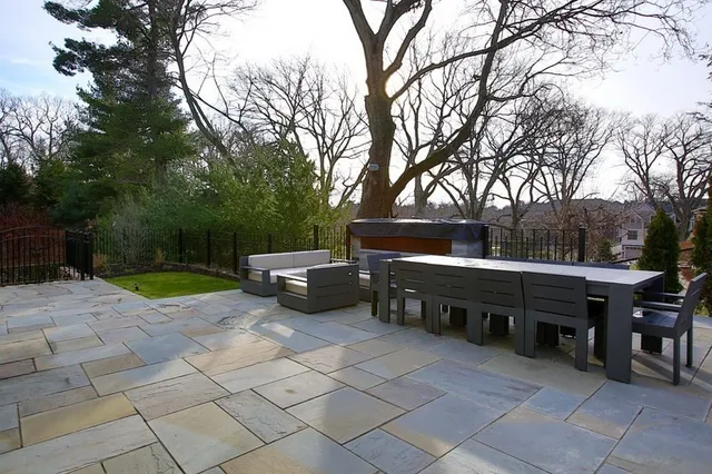 a view of backyard with sitting area