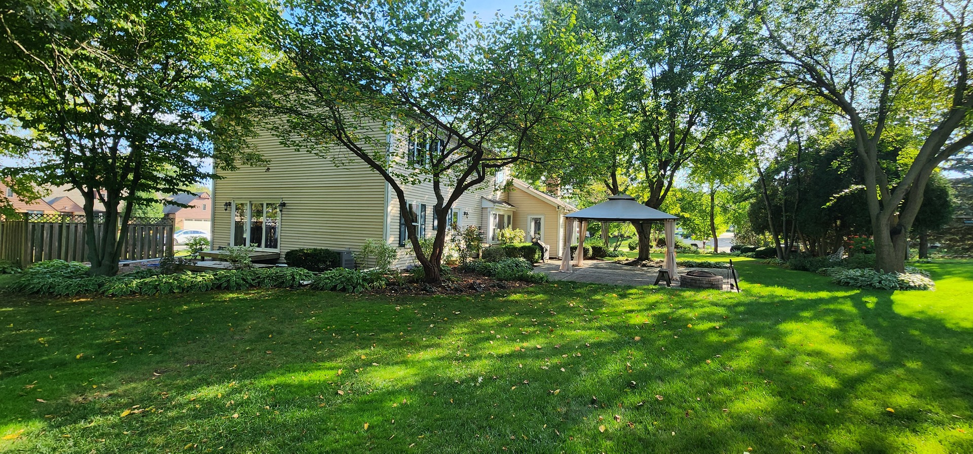 68 Winthrop New Road Sugar Grove, IL 60554 - Photo 5 of 7 a view of a house with backyard sitting area and garden