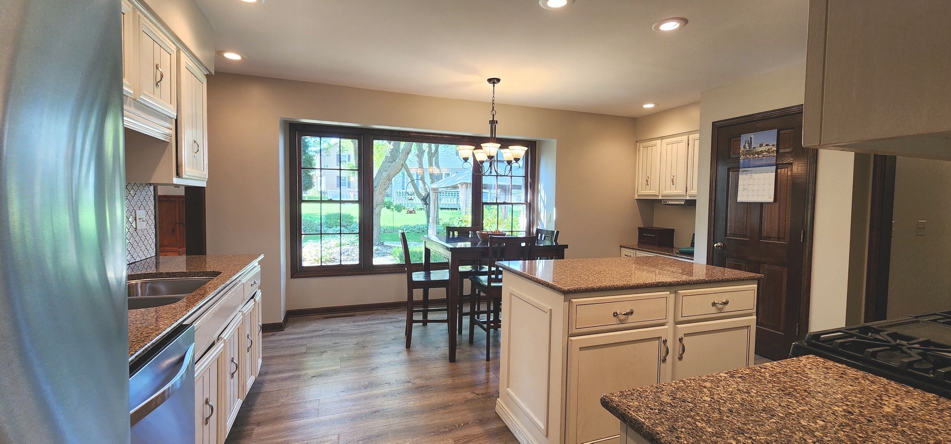 68 Winthrop New Road Sugar Grove, IL 60554 - Photo 6 of 7 a open kitchen with stainless steel appliances granite countertop a stove and a refrigerator