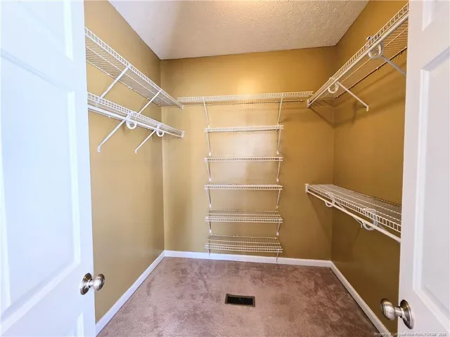 a view of a room with racks on the wall