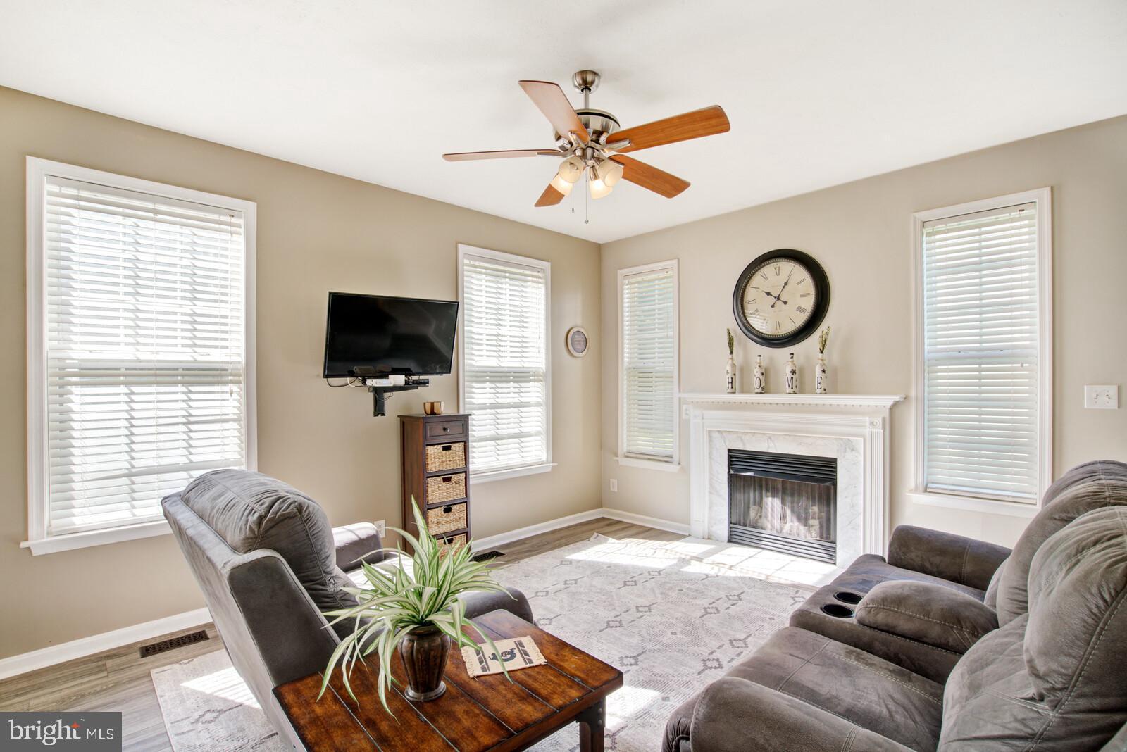 8857 Mullen Road King George, VA 22485 - Photo 13 of 40 Bright family room off kitchen. Cozy fireplace!