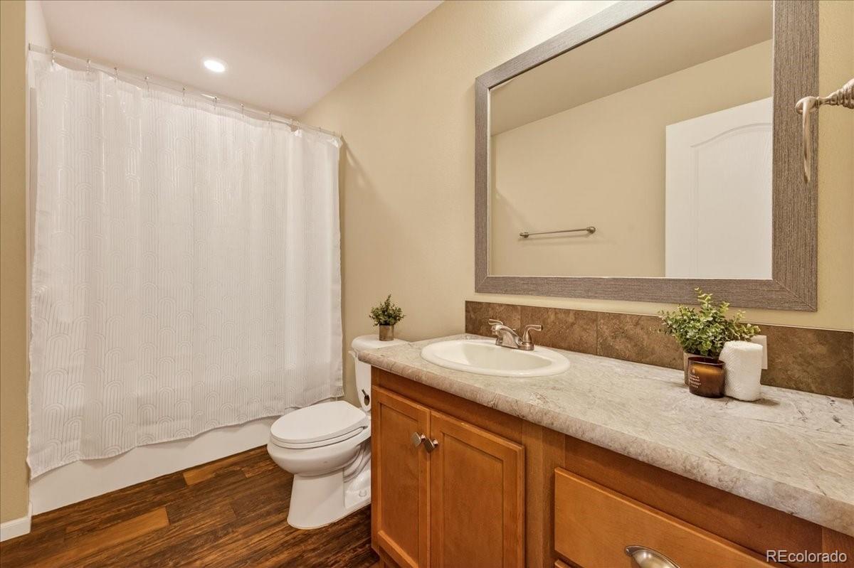 53 Brook Trout Loop Gypsum, CO 81637 - Photo 22 of 38 a bathroom with a granite countertop sink a toilet and a mirror