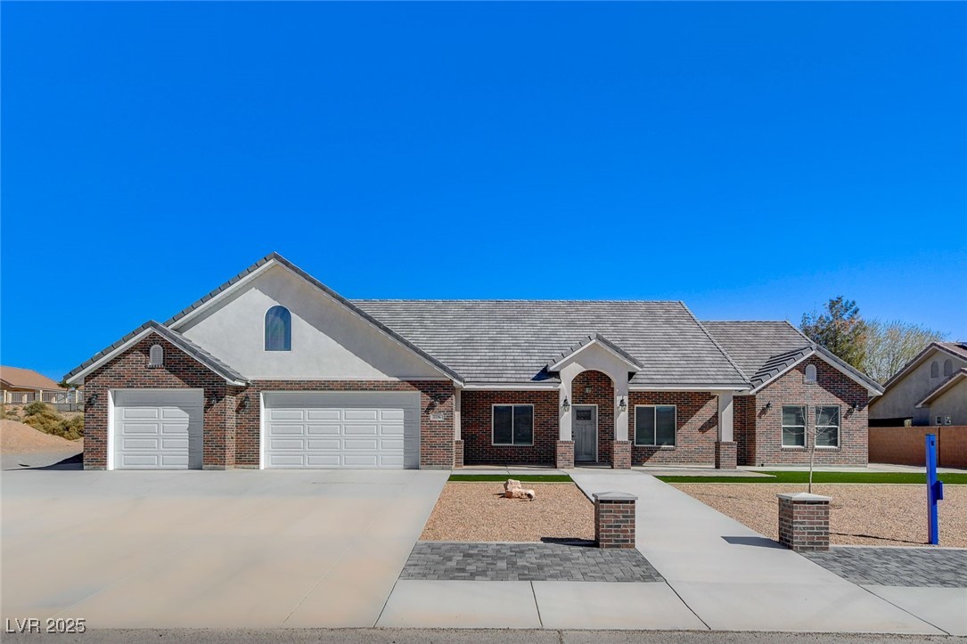 View of front of house featuring an attached garag