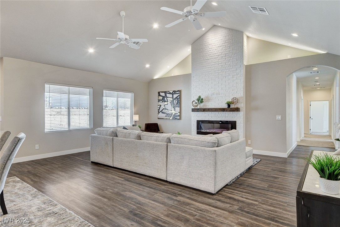 3196 Mateuse Street Logandale, NV 89021 - Photo 11 of 85 Living area with dark wood-style floors, a firepla