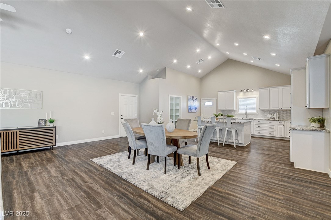 3196 Mateuse Street Logandale, NV 89021 - Photo 13 of 85 Dining space with high vaulted ceiling, dark woodl