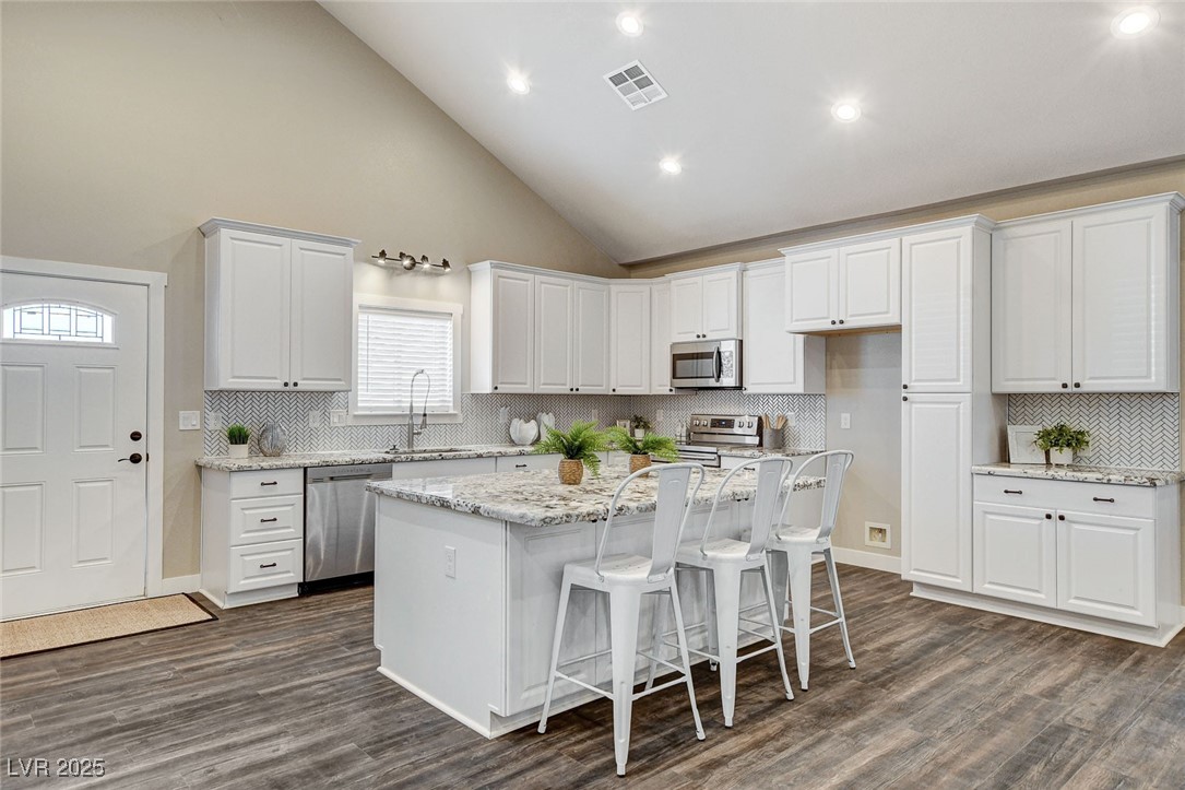3196 Mateuse Street Logandale, NV 89021 - Photo 16 of 85 Kitchen with dark wood-type flooring, a sink, visi