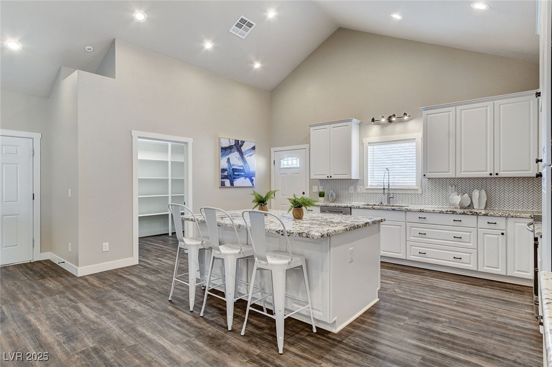 3196 Mateuse Street Logandale, NV 89021 - Photo 17 of 85 Kitchen featuring a sink, white cabinetry, a cente