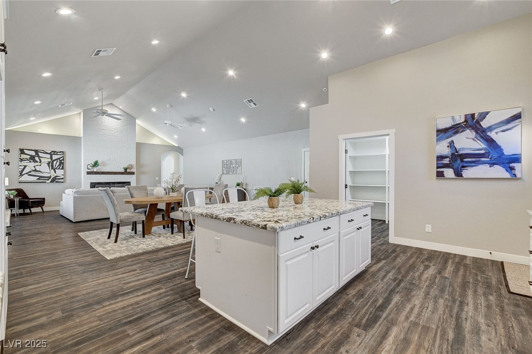 3196 Mateuse Street Logandale, NV 89021 - Photo 18 of 85 Kitchen with view of a large brick fireplace, a ki