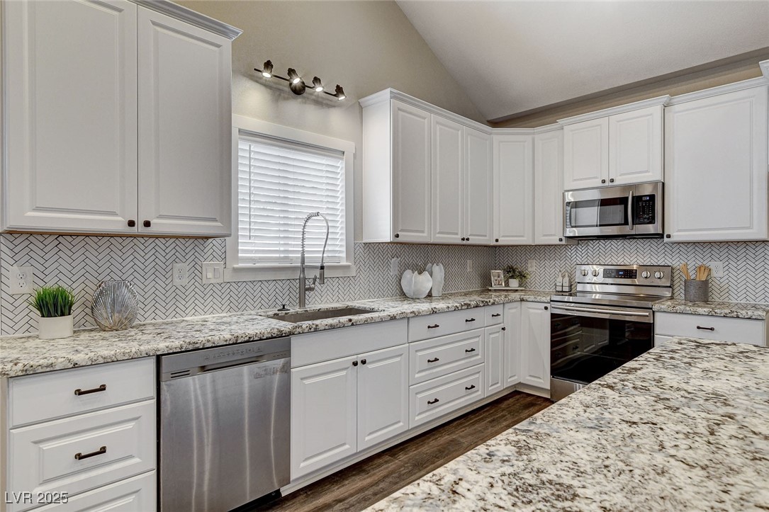 3196 Mateuse Street Logandale, NV 89021 - Photo 20 of 85 Kitchen with lofted ceiling, stainless steel appli