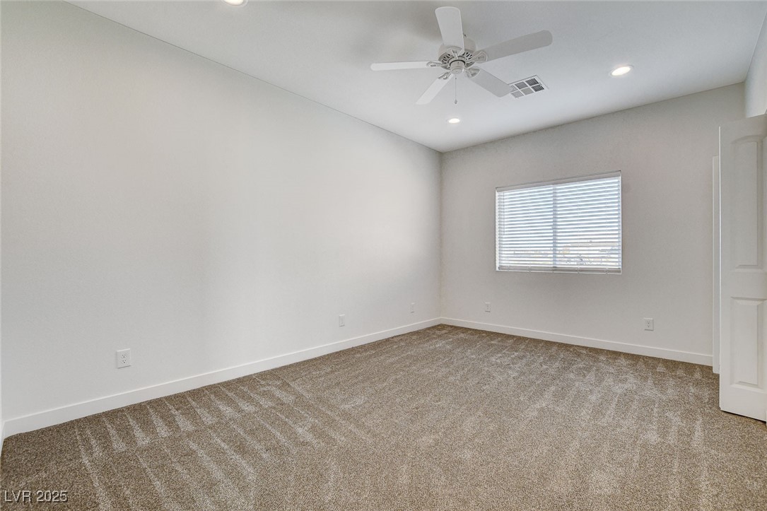 3196 Mateuse Street Logandale, NV 89021 - Photo 22 of 85 Carpeted room 2 with baseboards, a ceiling fan, an