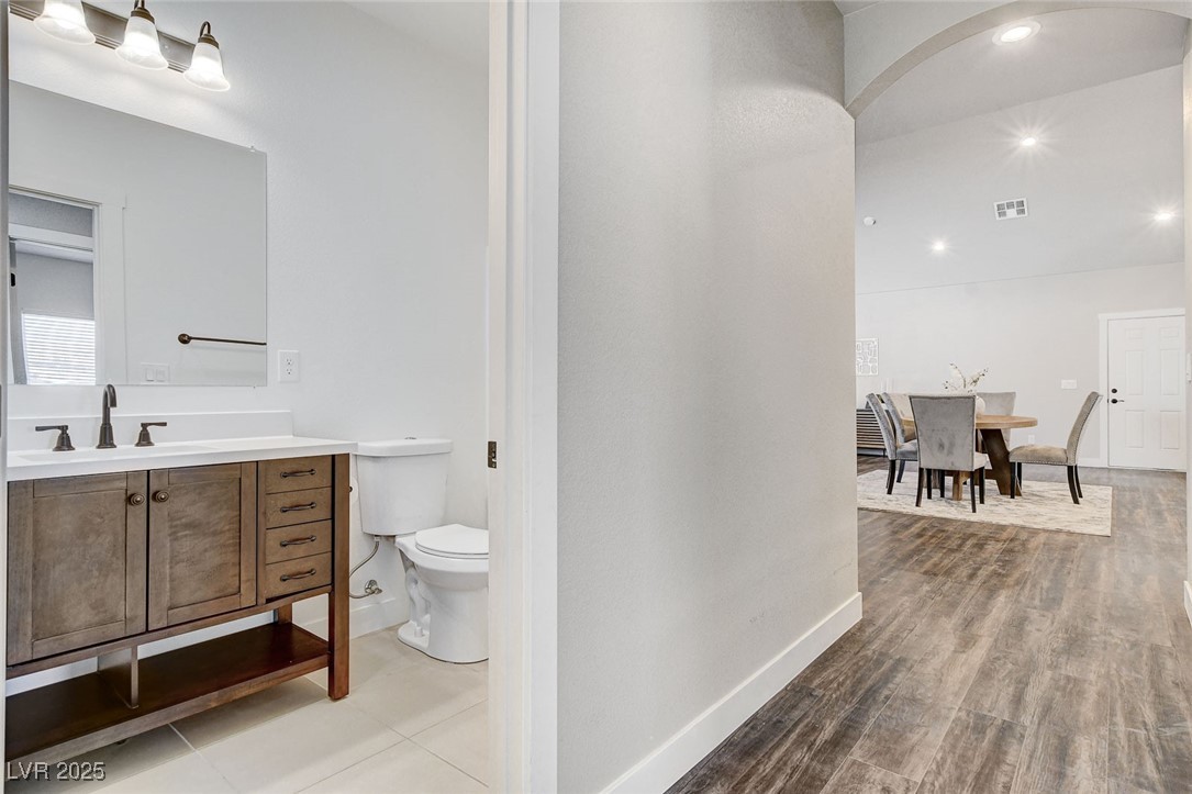 3196 Mateuse Street Logandale, NV 89021 - Photo 27 of 85 Bathroom featuring, toilet, vanity, woodlike lamin