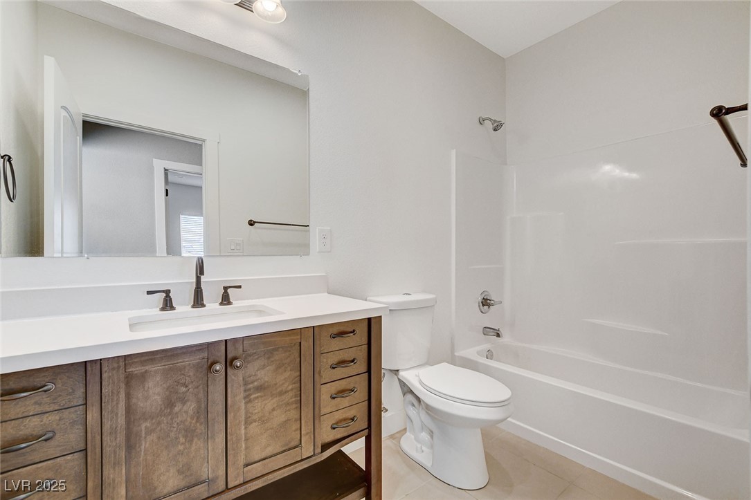 3196 Mateuse Street Logandale, NV 89021 - Photo 28 of 85 Full bath featuring toilet, tile patterned floors,