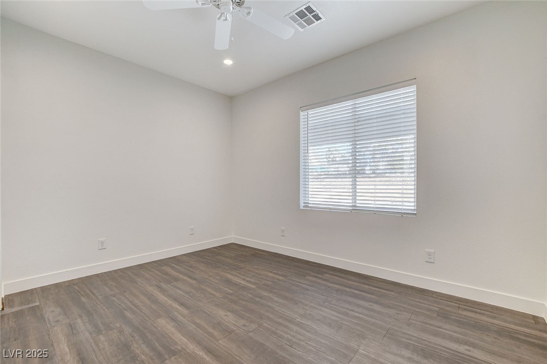 3196 Mateuse Street Logandale, NV 89021 - Photo 29 of 85 Bedroom 3 with a ceiling fan, dark woodlike-style