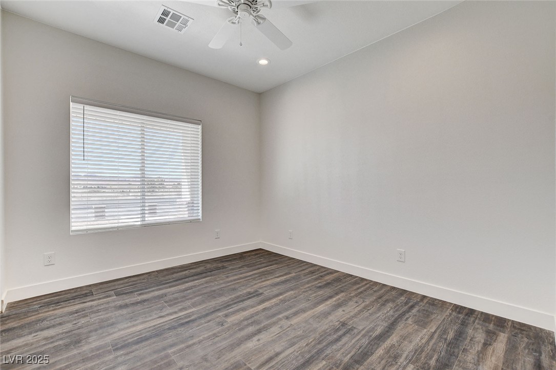 3196 Mateuse Street Logandale, NV 89021 - Photo 33 of 85 Bedroom 4 featuring dark woodlike-style flooring,