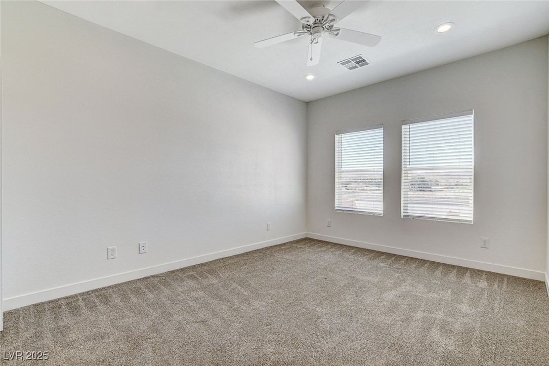 3196 Mateuse Street Logandale, NV 89021 - Photo 36 of 85 Bedroom 5 with baseboards, ceiling fan, carpet, re