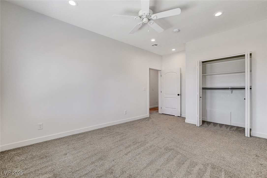 3196 Mateuse Street Logandale, NV 89021 - Photo 38 of 85 Bedroom 5 featuring baseboards, a ceiling fan, car
