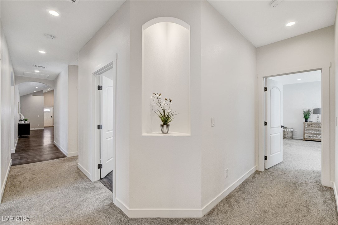 3196 Mateuse Street Logandale, NV 89021 - Photo 39 of 85 Hallway featuring arched walkways, carpet floors,