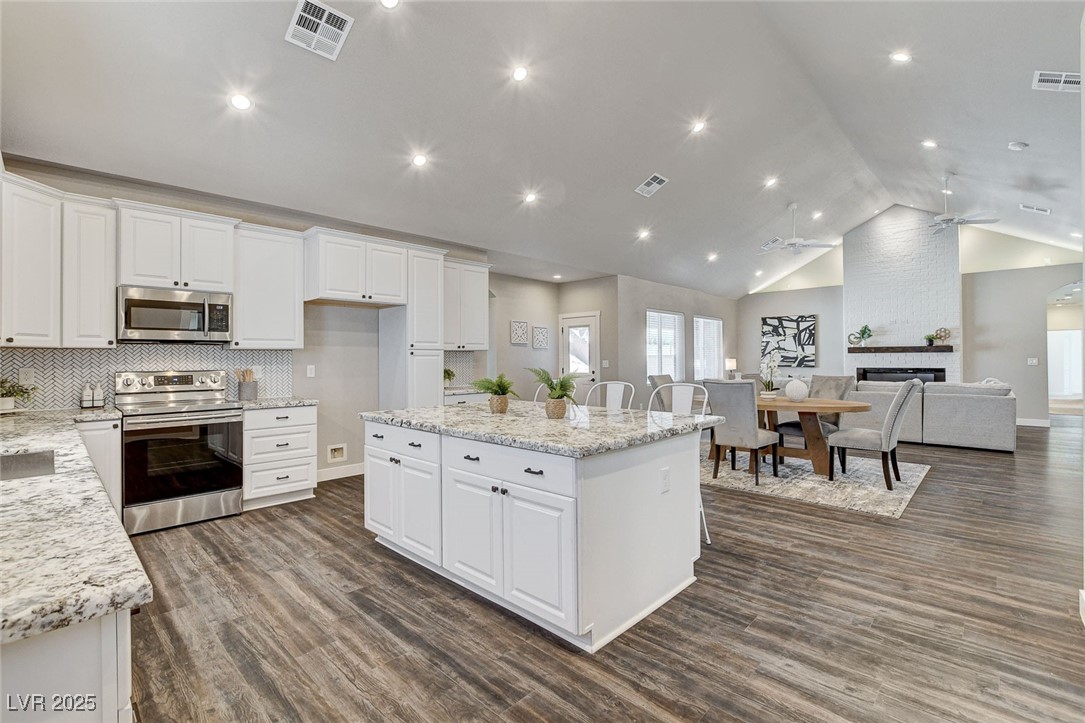 3196 Mateuse Street Logandale, NV 89021 - Photo 4 of 85 Kitchen with white cabinets, stainless steel appli