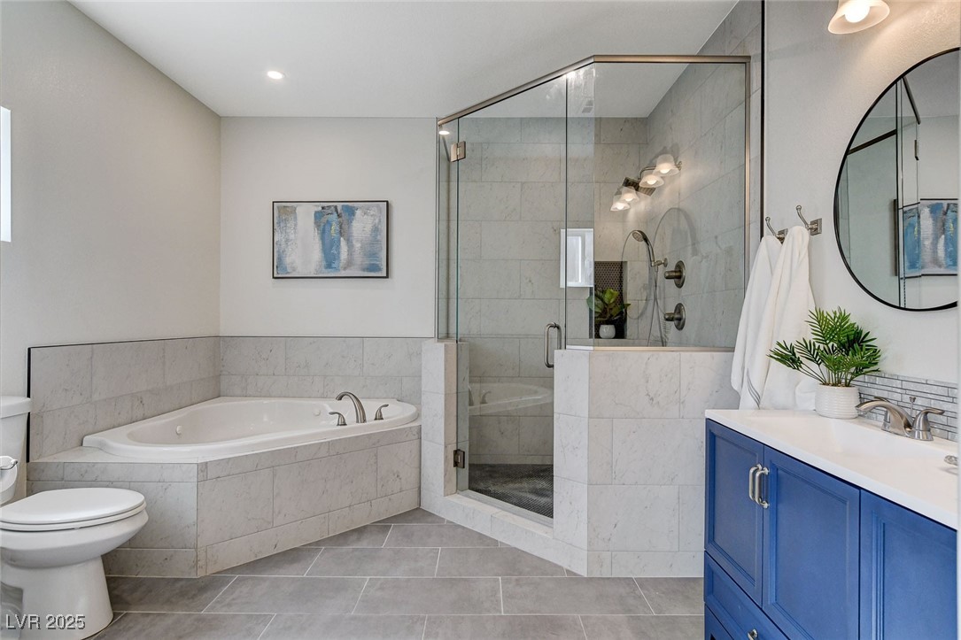 3196 Mateuse Street Logandale, NV 89021 - Photo 46 of 85 Primary bathroom with a stall shower, toilet, tile