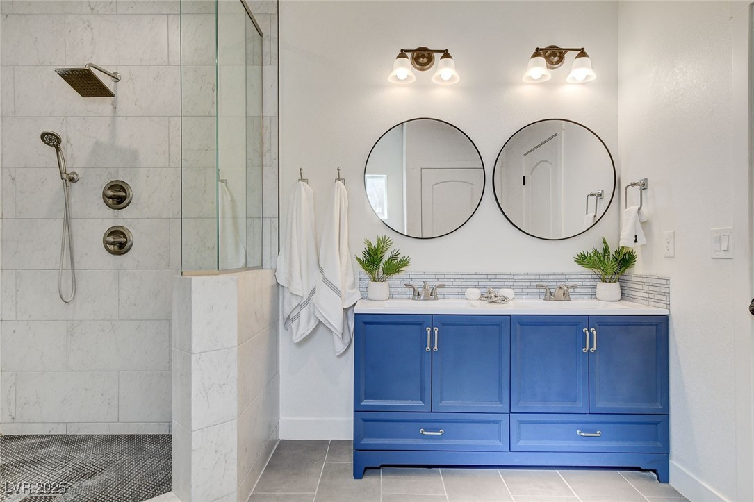 3196 Mateuse Street Logandale, NV 89021 - Photo 47 of 85 Full bath with double vanity, a sink, baseboards,