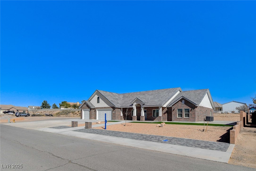 3196 Mateuse Street Logandale, NV 89021 - Photo 5 of 85 View of front of house featuring concrete driveway