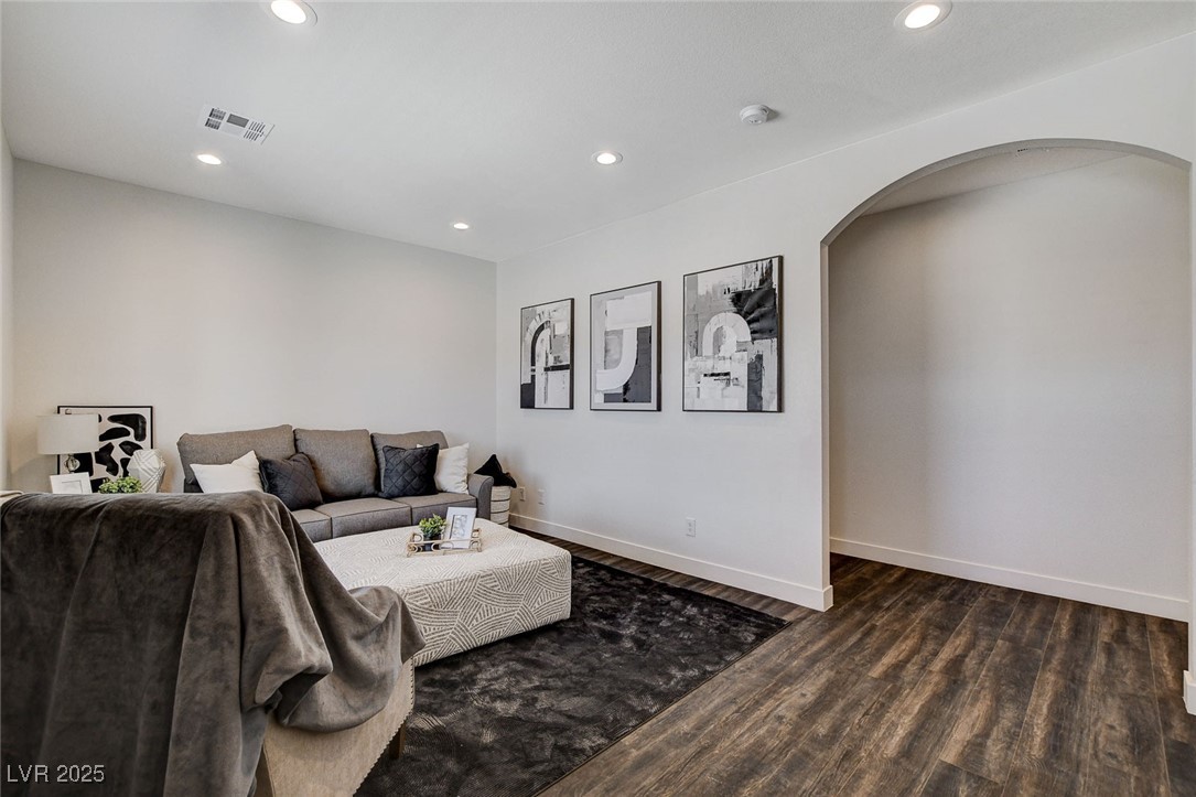 3196 Mateuse Street Logandale, NV 89021 - Photo 52 of 85 Formal living room with arched walkways, dark wood