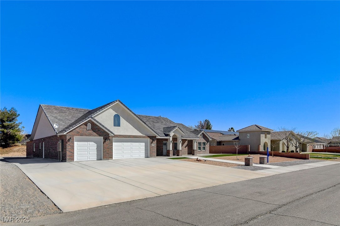 3196 Mateuse Street Logandale, NV 89021 - Photo 6 of 85 Single story home with a residential view, brick s