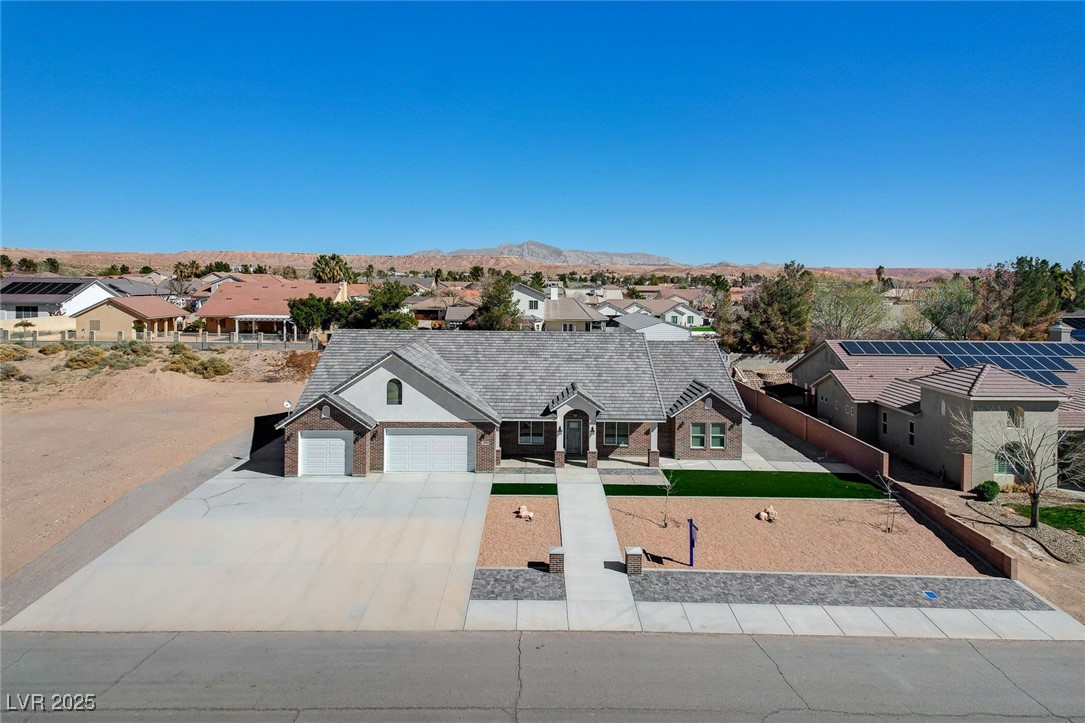3196 Mateuse Street Logandale, NV 89021 - Photo 64 of 85 View of front of home featuring driveway, an attac