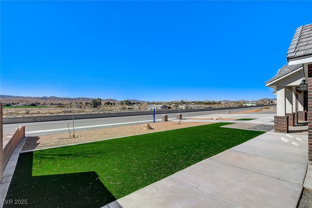 3196 Mateuse Street Logandale, NV 89021 - Photo 7 of 85 View of yard with low maintence turf and gorgeous