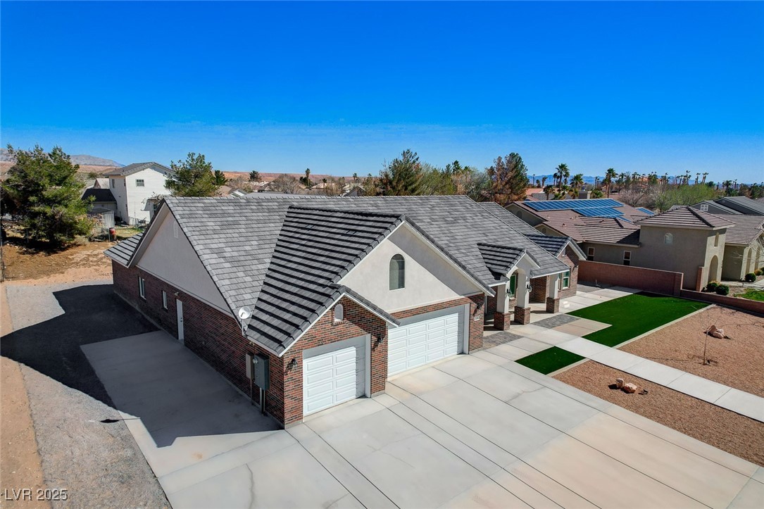 3196 Mateuse Street Logandale, NV 89021 - Photo 77 of 85 Single story home with brick siding, stucco siding